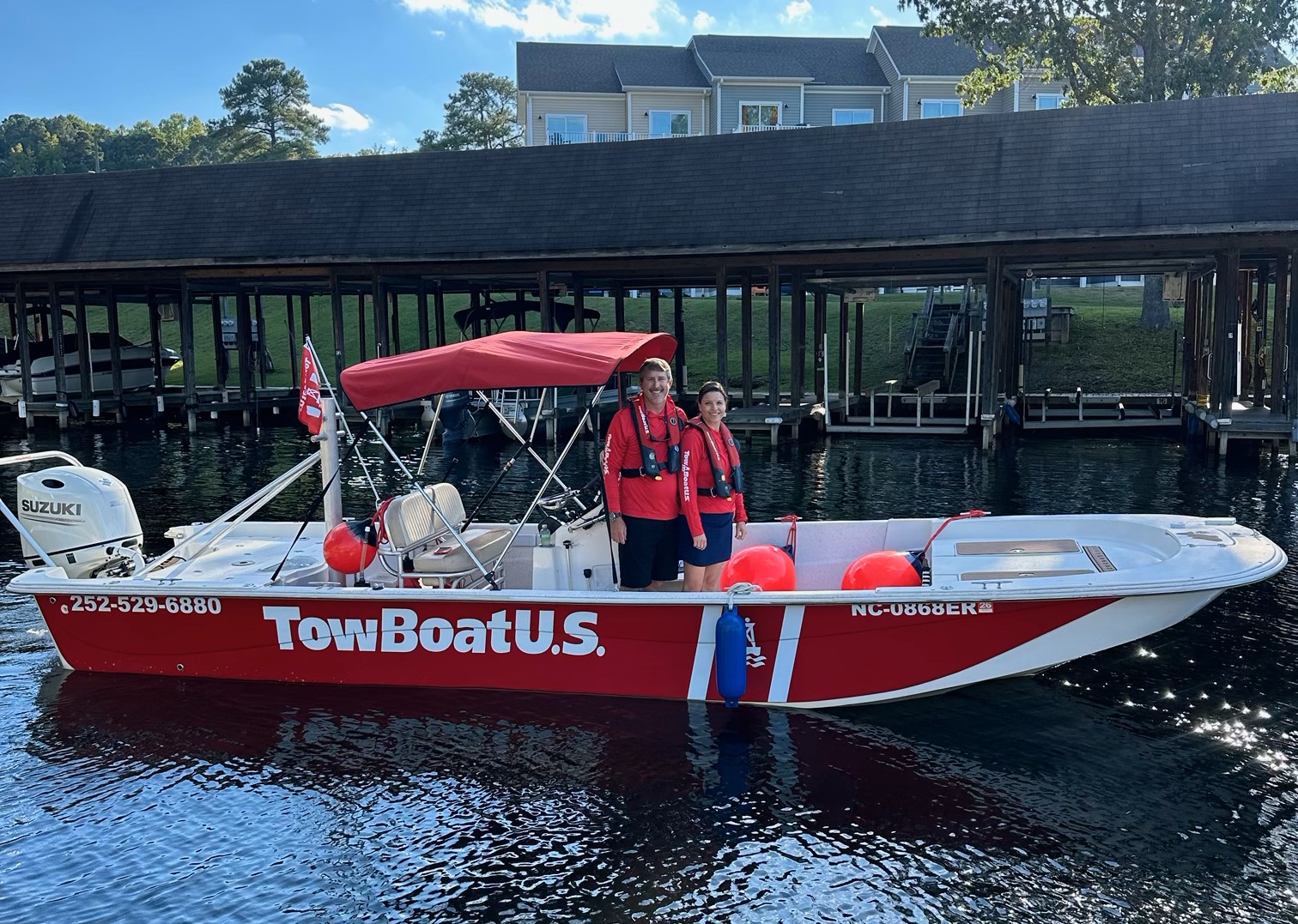 (L to R) Capts. Branson and Megan Mosier aboard their 25-foot Carolina Skiff TowBoatUS response vessel on Lake Gaston.